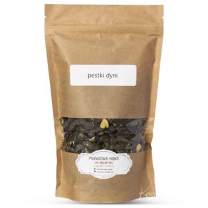 Brązowe opakowanie z pestkami dyni, etykieta z napisem pestki dyni, widoczna przezroczysta sekcja na dole.