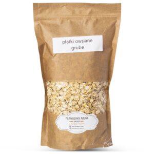 Opakowanie grubych płatków owsianych w brązowej torbie papierowej z etykietą informacyjną.