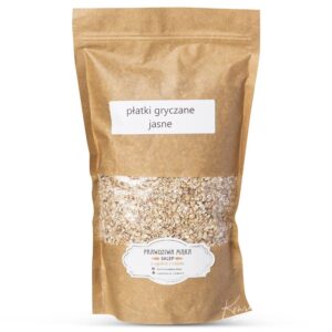 Opakowanie płatków gryczanych jasnych w brązowej torbie papierowej z etykietą produktu.
