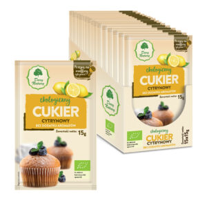 Ekologiczny cukier cytrynowy Dary Natury, bez dodatku aromatów, 15g, z opakowaniem muffinów w tle.