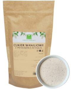 Opakowanie cukru waniliowego Green Essence, obok miseczka z cukrem. Naturalny składnik do deserów i napojów.