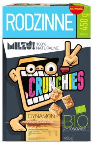 Opakowanie płatków Milzu! Crunchies, smak cynamonowy, 450 g, z ilustracją postaci i informacją o naturalnych składnikach.