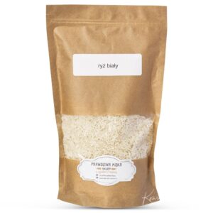 Eco-friendly paper bag with white rice, labeled ryż biały, isolated on a white background.