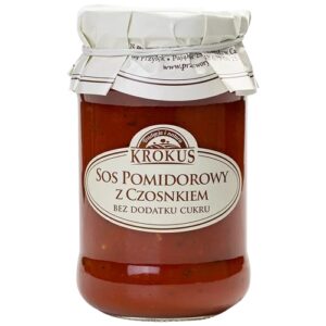 Słoik sosu pomidorowego z czosnkiem marki Krokus, bez dodatku cukru, z przezroczystym wieczkiem i etykietą.