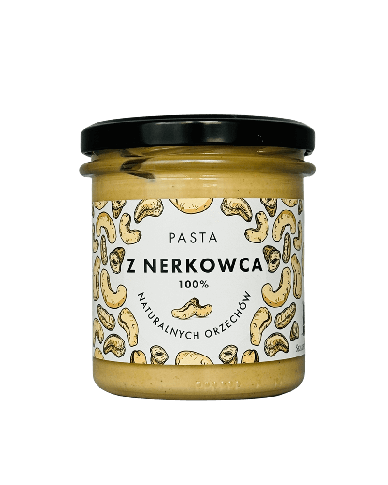 Słoik pasty z nerkowców 100% naturalnych orzechów z czarną zakrętką i etykietą z rysunkami nerkowców.