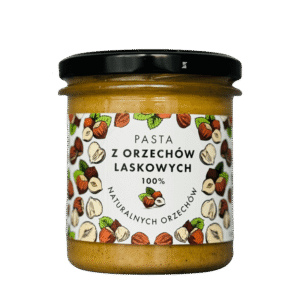 Słoik z pastą z orzechów laskowych, 100% naturalnych. Kremowa konsystencja, etykieta z grafiką orzechów.